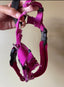 Damaged pink harness